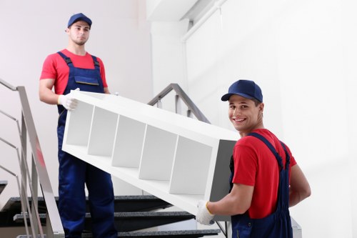 Furniture being carefully loaded into a removals van for a local move