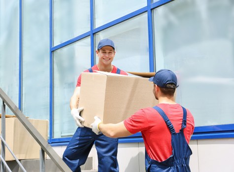 Loading furniture into a van for a Colliers Wood home or office move