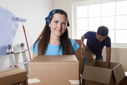 Team handling sofas, beds, and wardrobes during a Colliers Wood move
