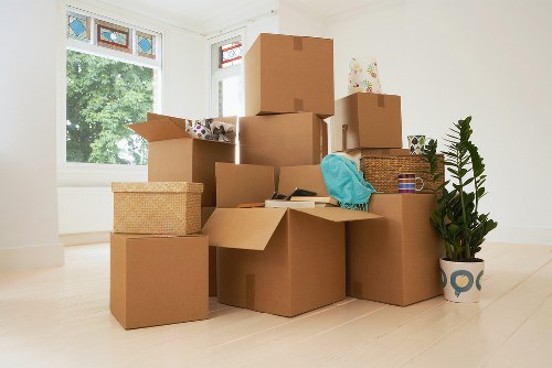 Packed household boxes and furniture prepared for a Colliers Wood relocation