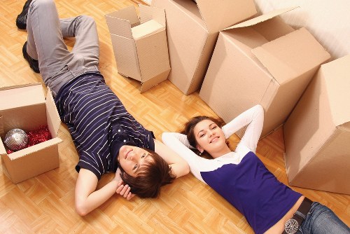 Packed office boxes and furniture prepared for transport in Colliers Wood